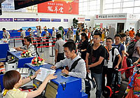 passengers queuing for check-in in Xiamen airport