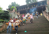 pilgrims leaving Bao Guo Si Temple at Emeishan foot on 17th July