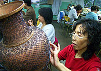 People working on copper base